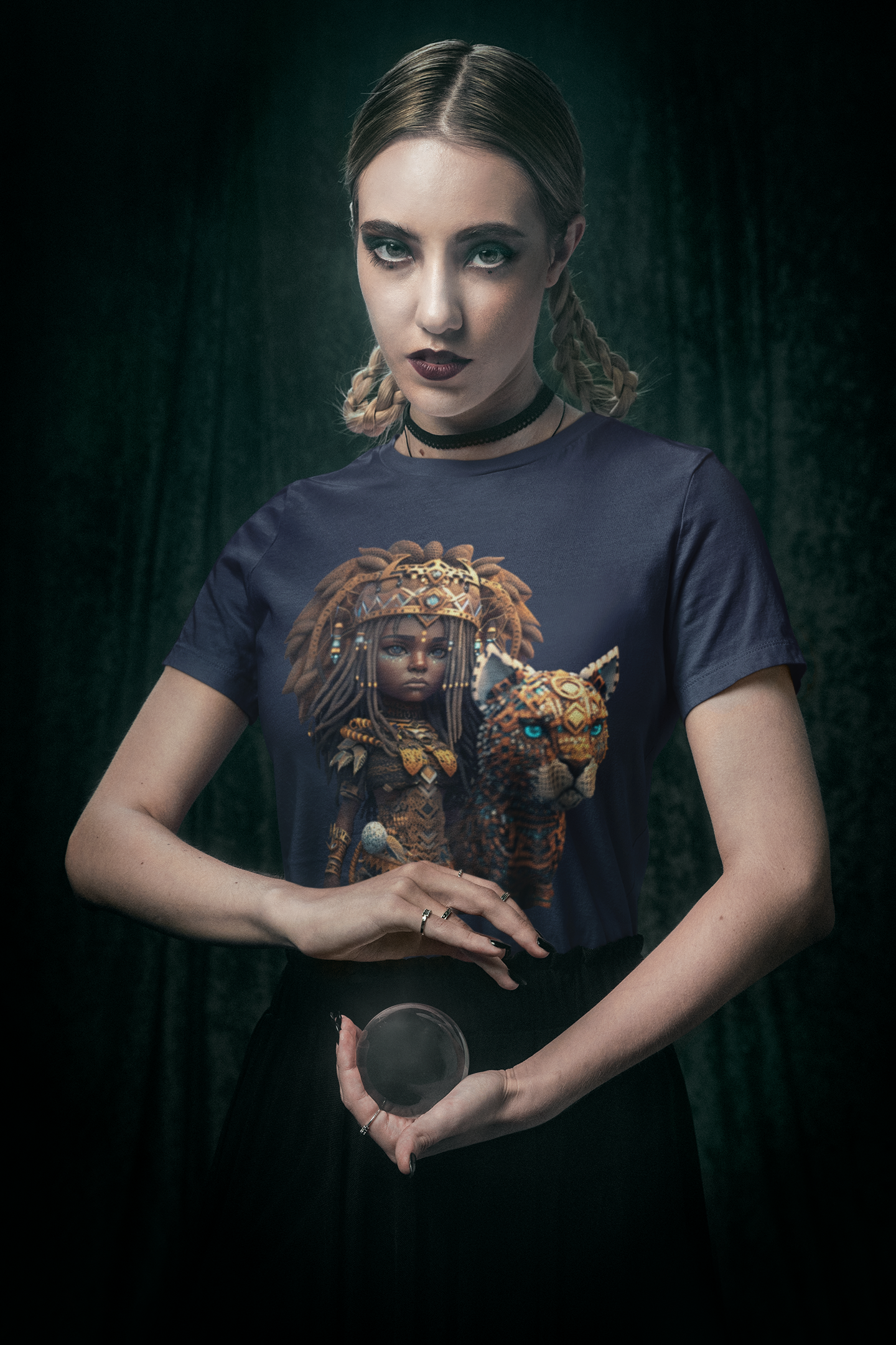 navy colour bella canvas t-shirt which has a design of a pop anime African princess with her leopard pet worn by a woman with a crystal ball